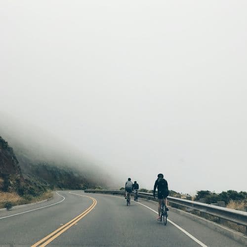 three-men-biking-on-asphalt-road-95-YnGEj-wA